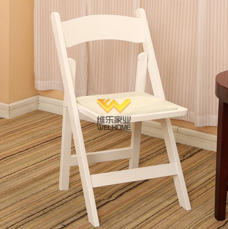 White wooden folding chair for wedding/event